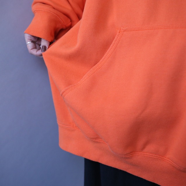 "Carhartt" sleeve logo printed over silhouette orange sweat parka