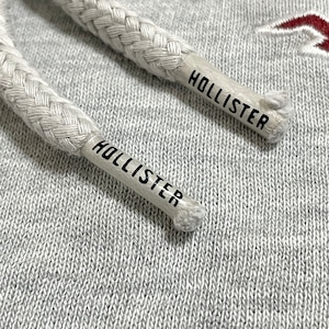 【HOLLISTER】ワンポイント 刺繍ロゴ パーカー プルオーバー フーディー スウェット ラグランスリーブ 切替 S ホリスター US古着