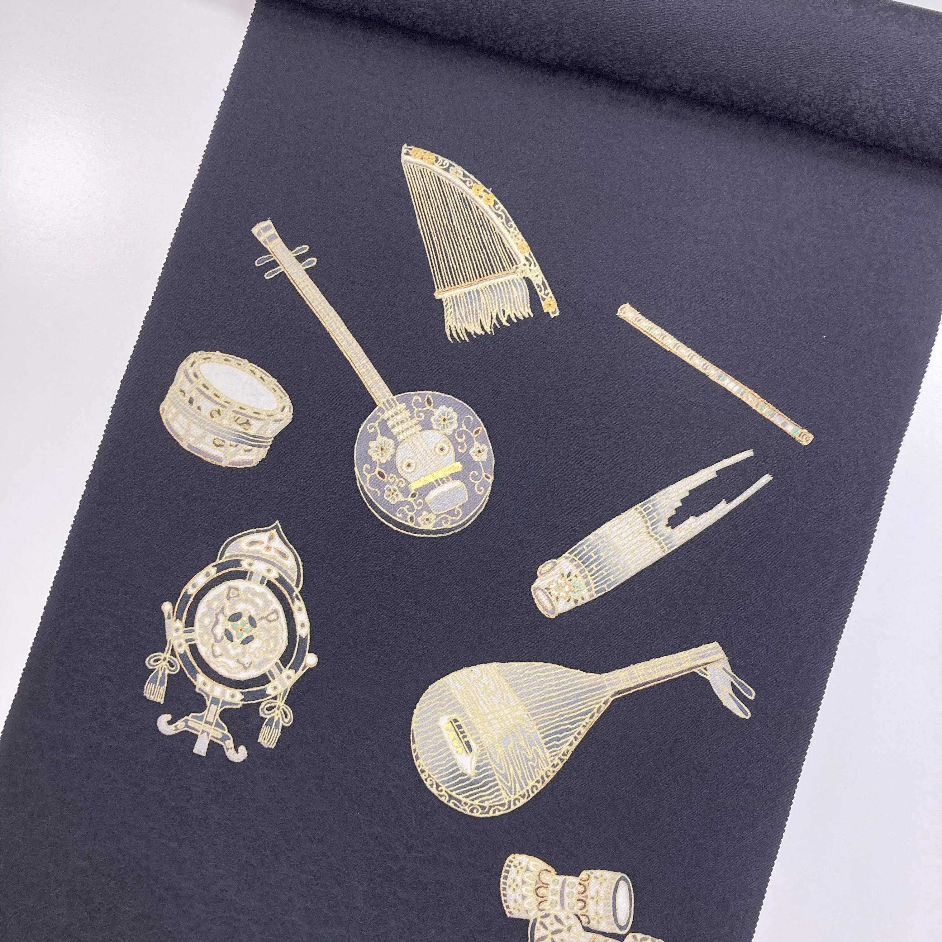 楽器柄 心憎い 名古屋帯