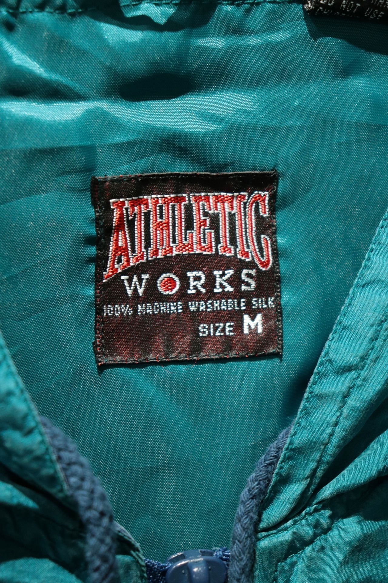 ATHLETIC switching design silk hooded blouson