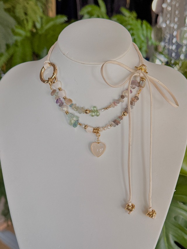 Crystal heart charm leather choker.