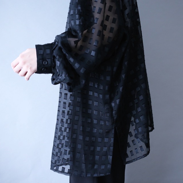 block pattern XXX over silhouette black see-through shirt