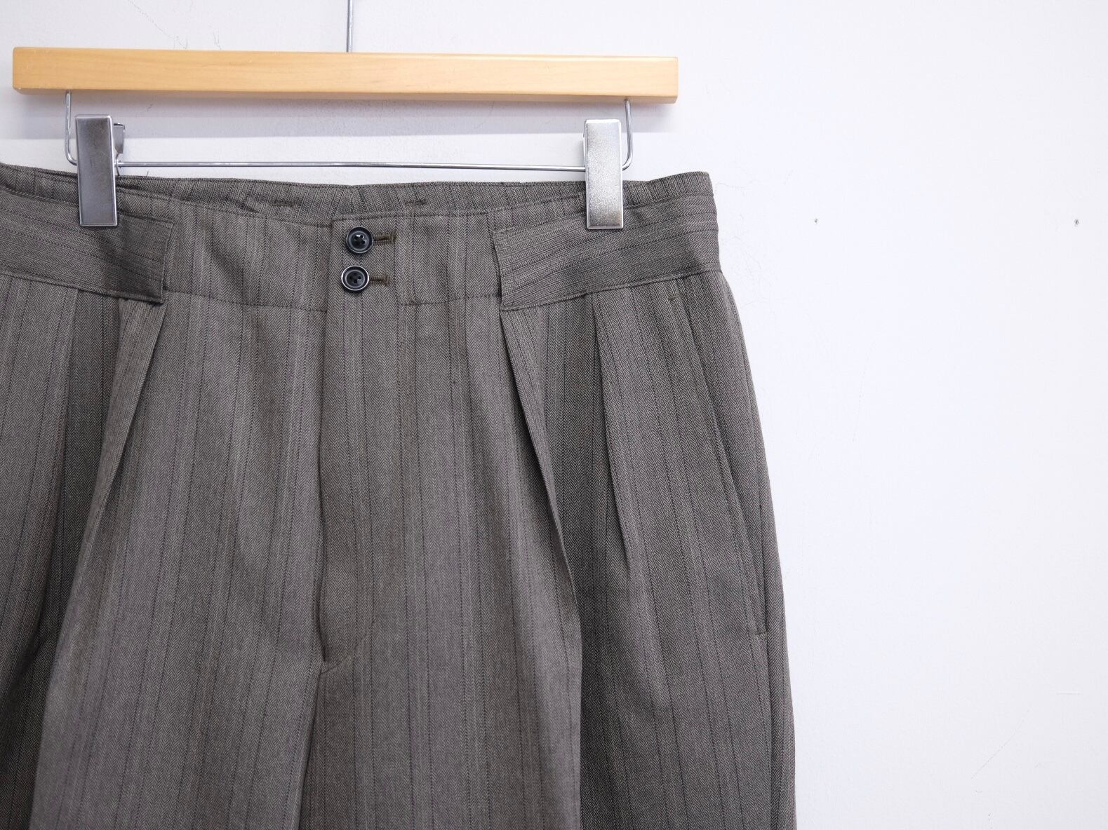 ULTERIOR” MELANGE HERRINGBONE STRIPE TUCKED TROUSERS” | Lapel