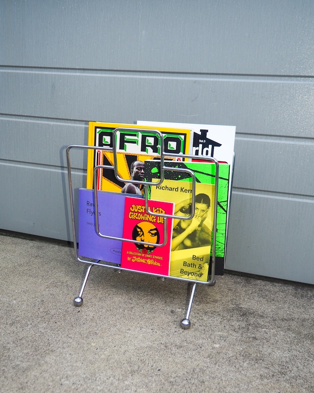 Chrome-plated geometric wireframe magazine rack