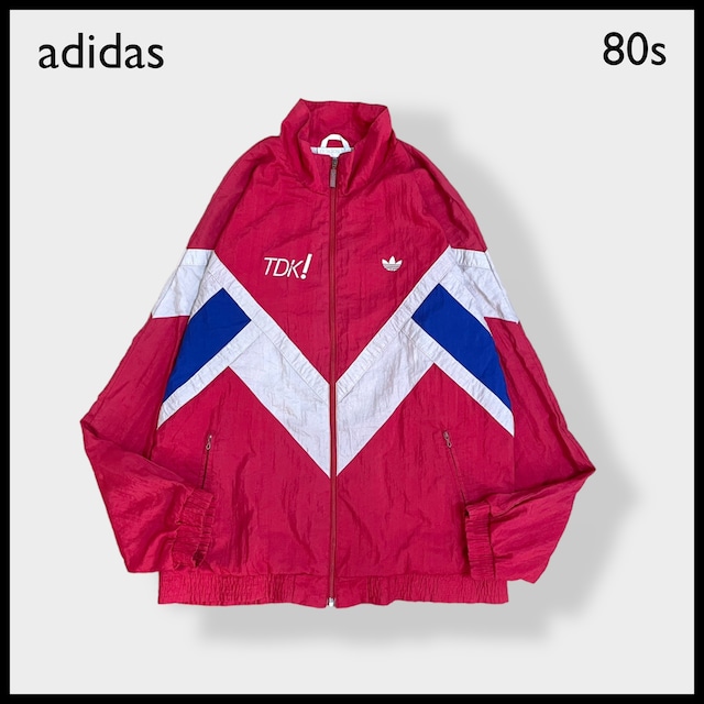 【adidas】80s 世界陸上 1991 東京大会 企業系 企業ロゴ スポンサー TDK ナイロンジャケット ブルゾン プリント 刺繍ロゴ トレフォイル ワンポイント 切替 銀タグ 万国旗タグ コピーライト1988 ヴィンテージ 希少 アディダス us古着