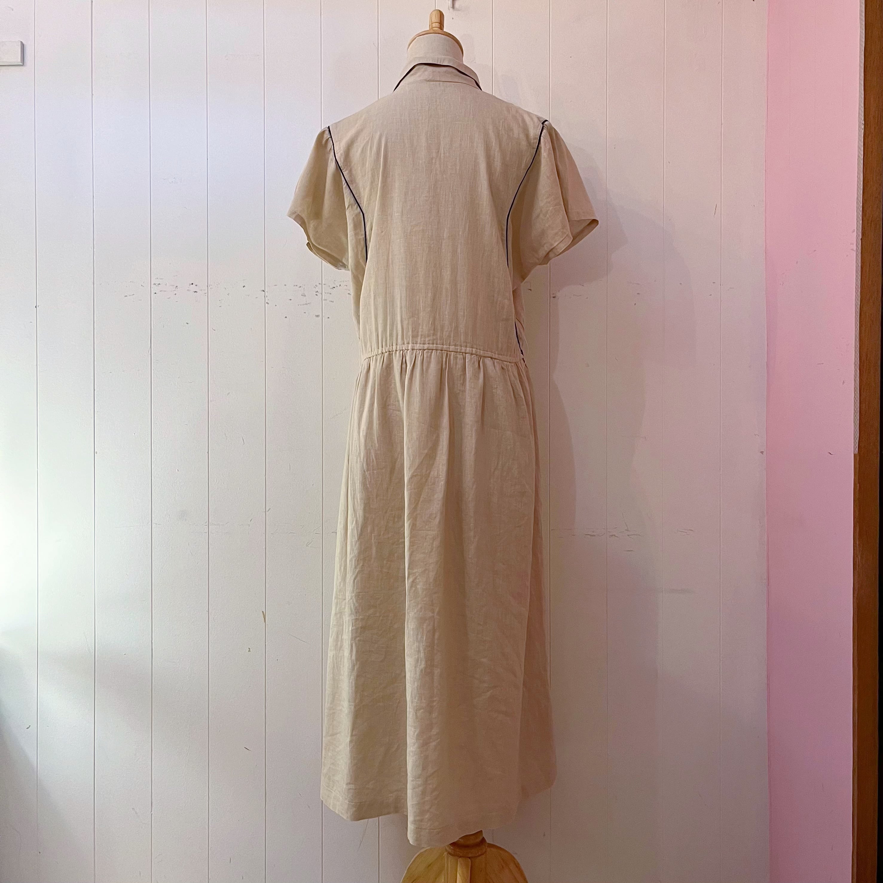 beige open collar one-piece