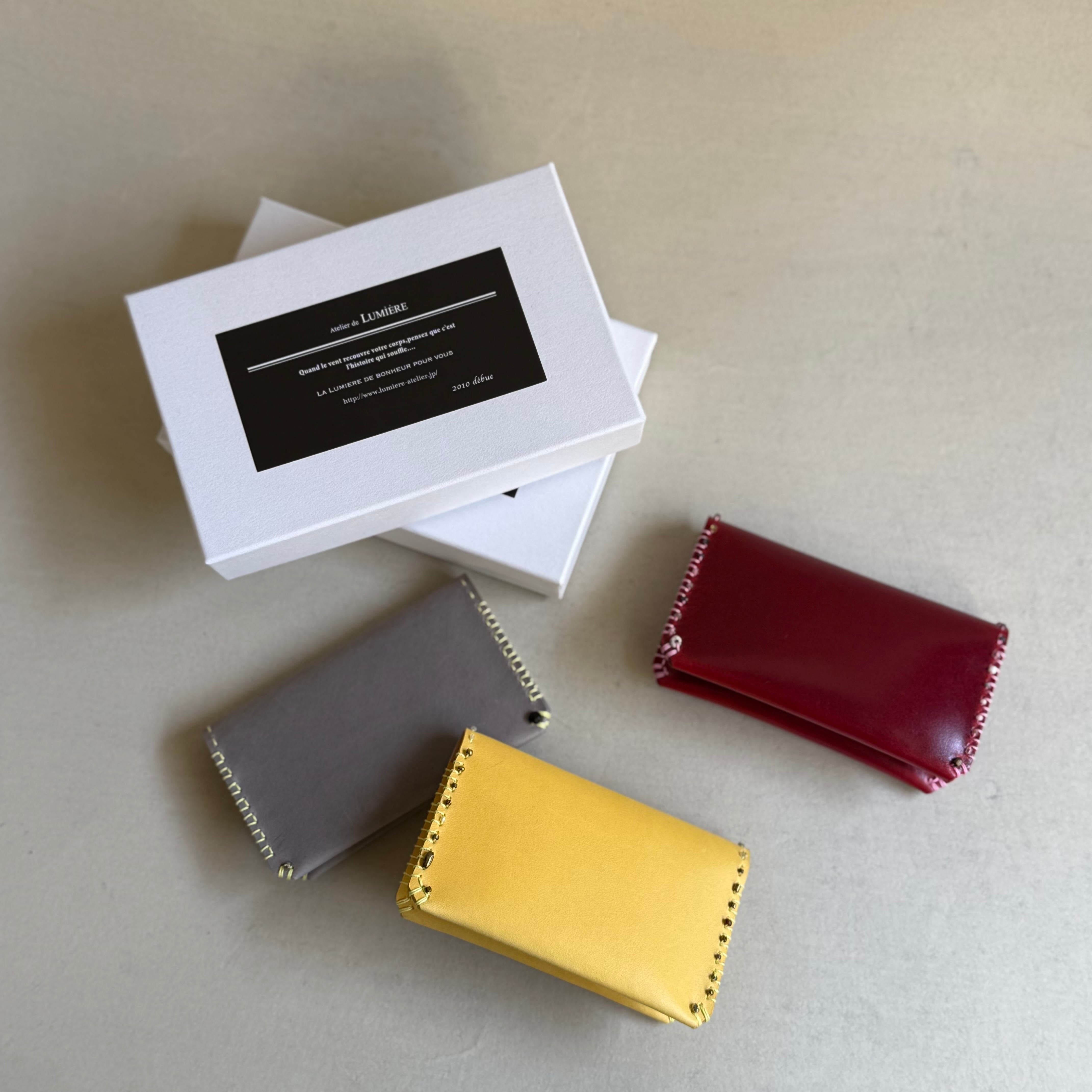 Atelier de LUMIÉR BIJOUX card case 黄グレー 赤