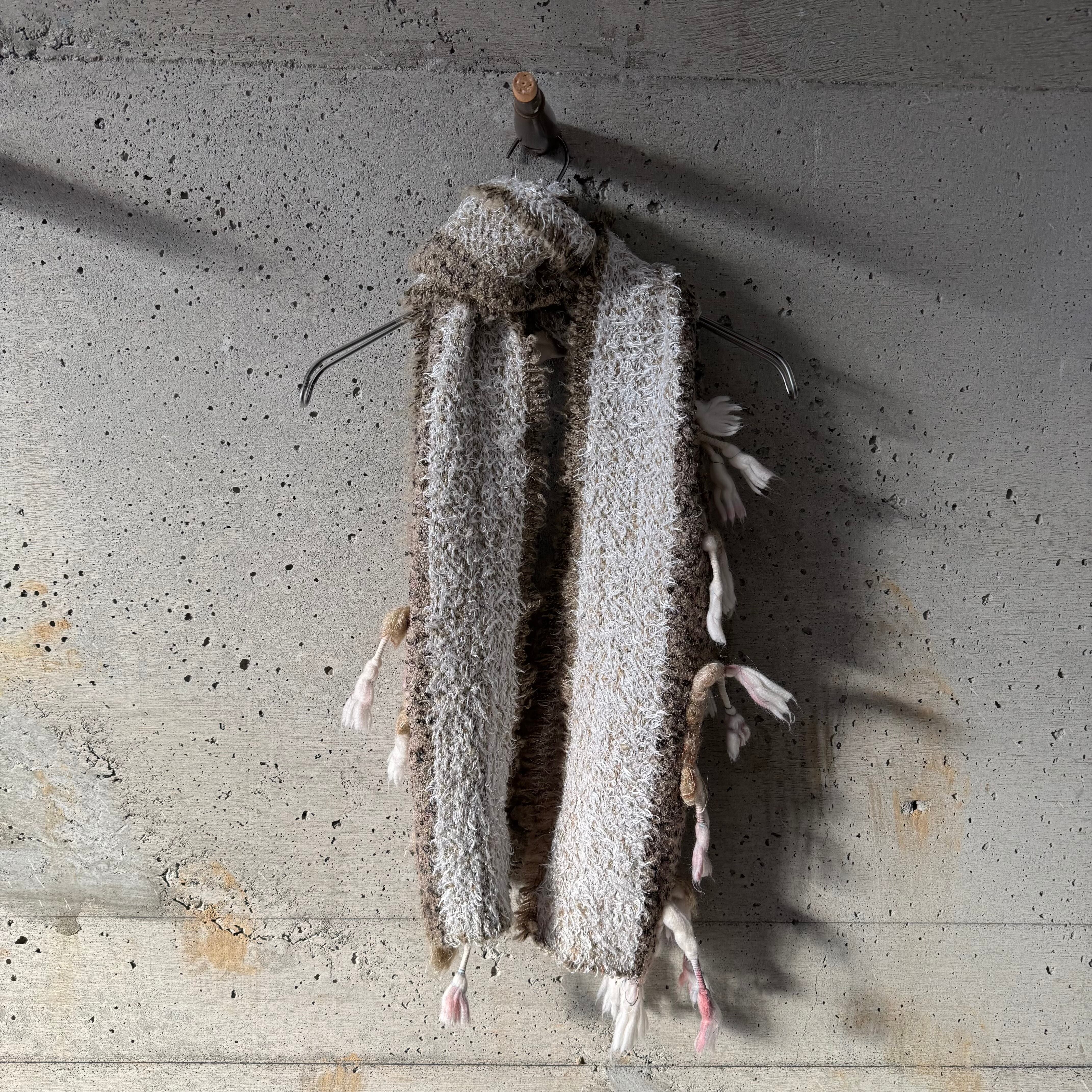 A scarf with threads sticking out