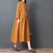 新しい春秋の女性服、韓国風のゆったりとした大きいサイズの痩身婦人服、ファッショナブルで快適なリネン無地のミドル丈シャツスカート