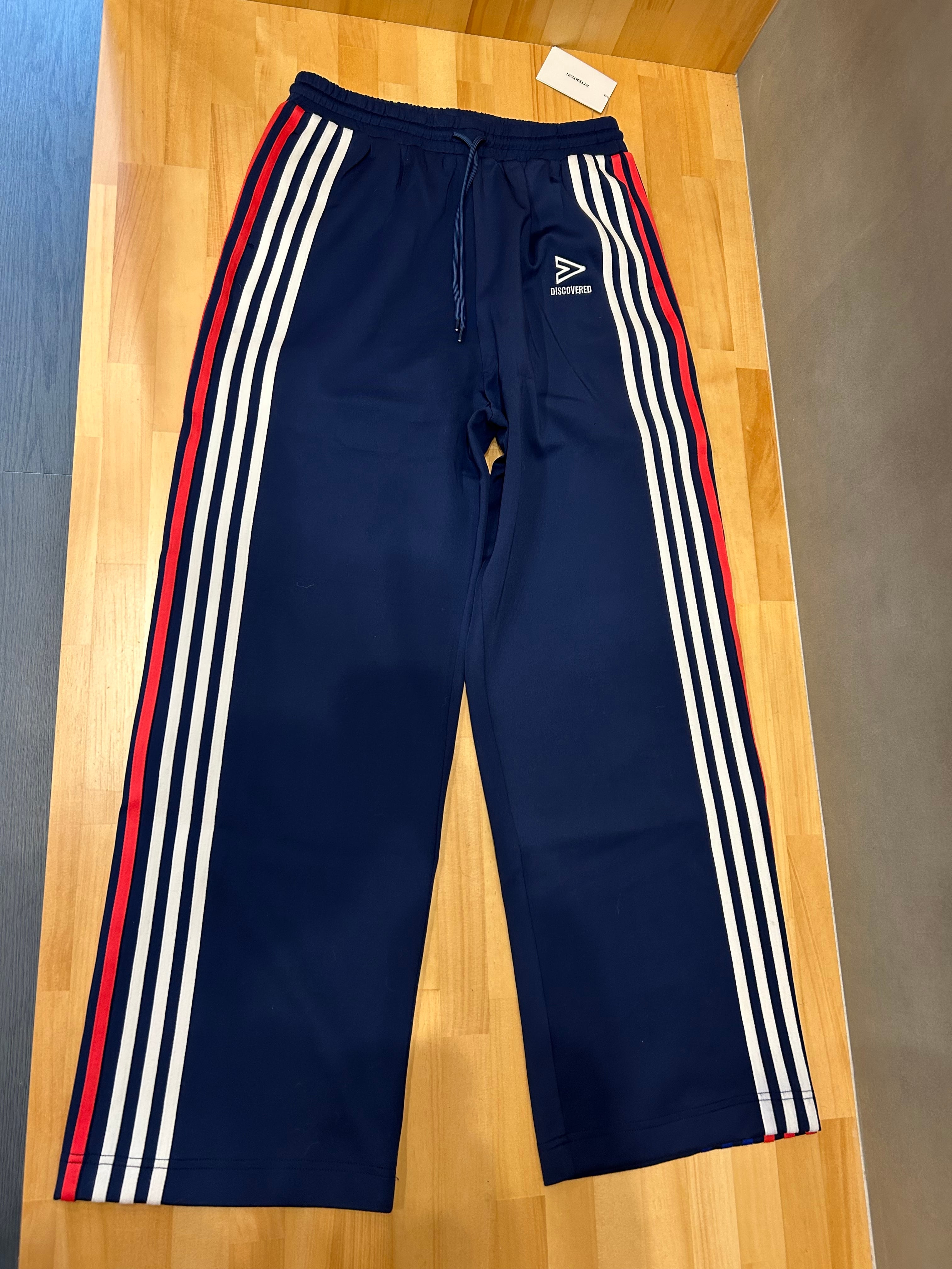 DISCOVERED ディスカバード】TRACK PANTS MULTI | delhezi