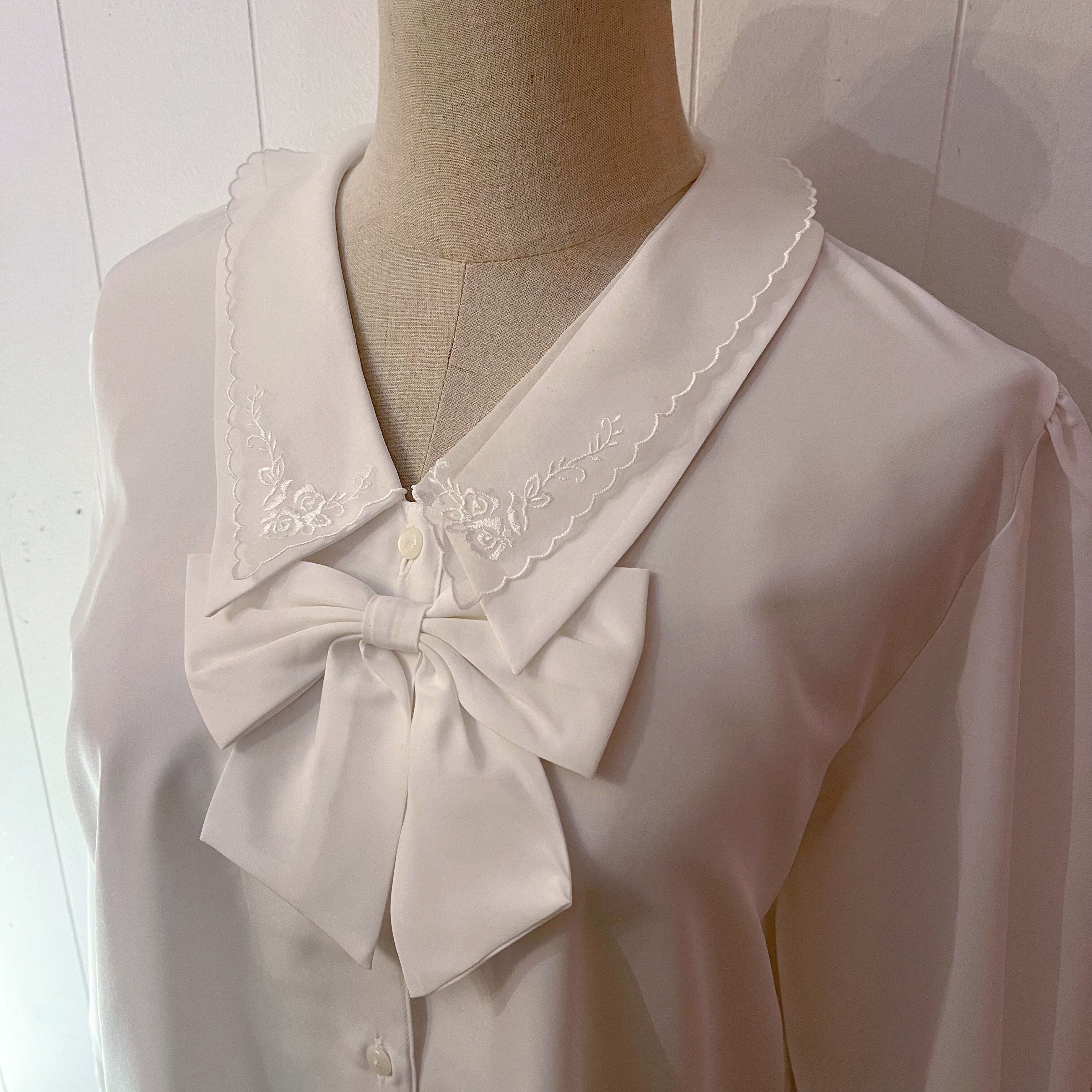 ribbon brooch white blouse