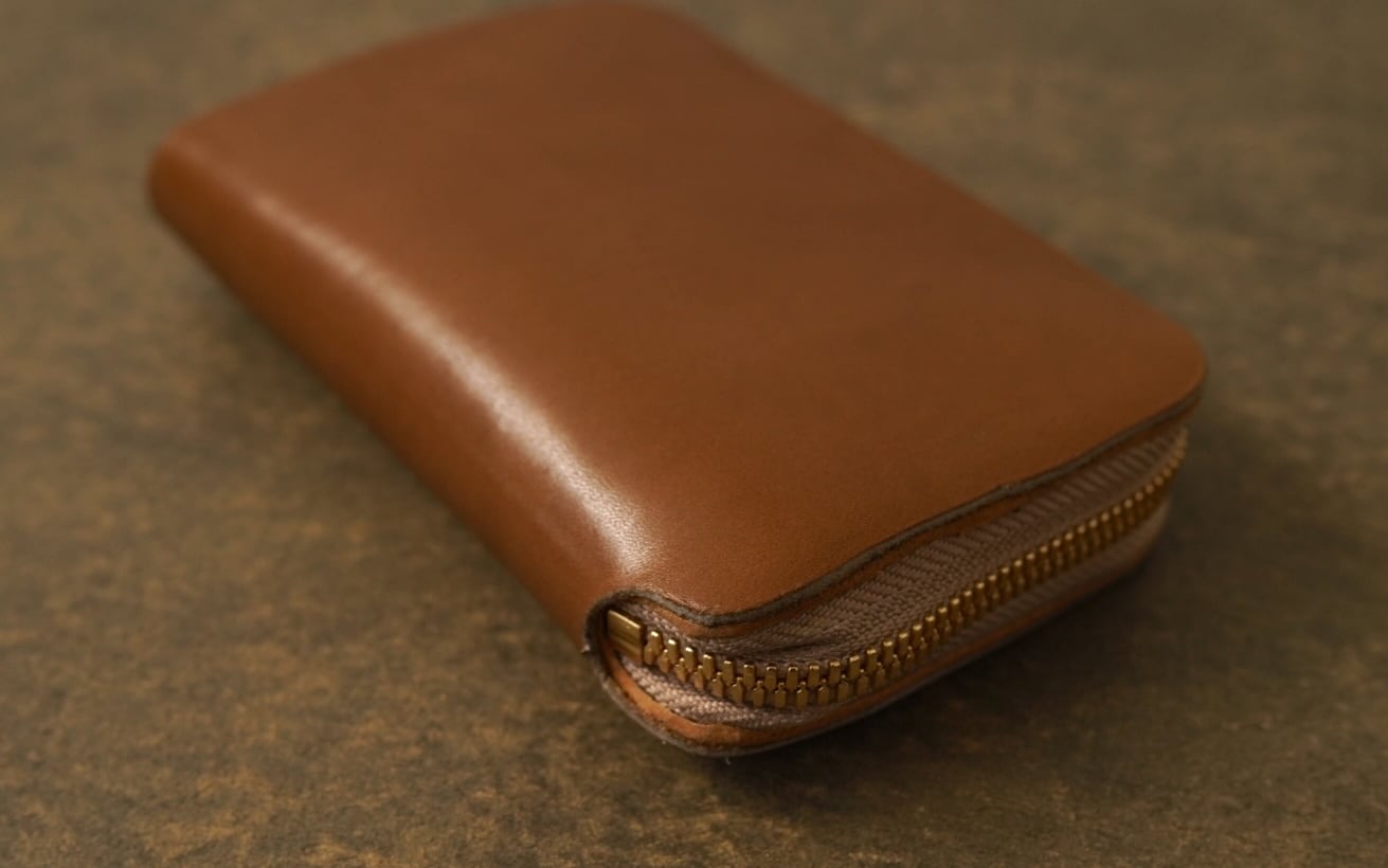 NAGI round zip wallet MID エヴァーカラー ゴールド | una