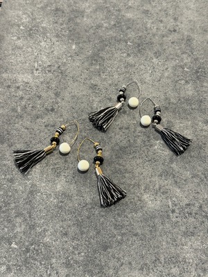 monotone tassel fringe hook design