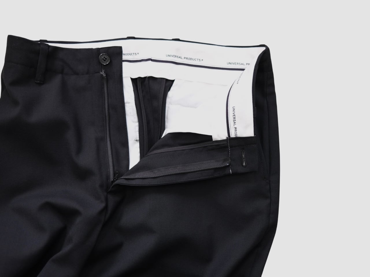 UNIVERSAL PRODUCTS.” SUMMER WOOL WIDE TROUSERS BLACK” | Lapel