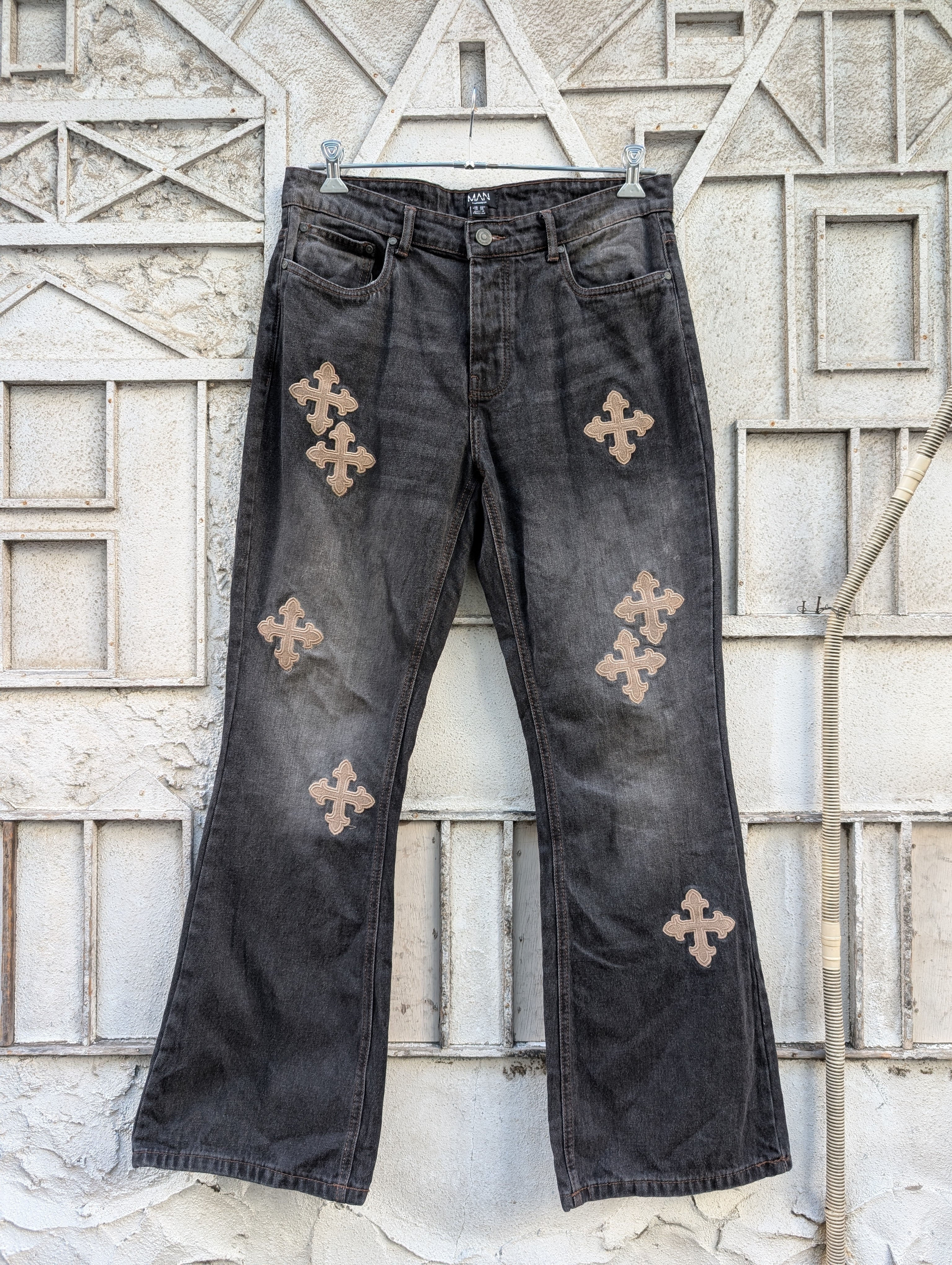 "MAN" cross embroidery black denim flare pants