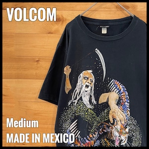 【VOLCOM】存在感のあるイラスト プリント Tシャツ ブランドロゴ バックロゴ Mサイズ  スケボー スノボー ボルコム メキシコ製 US古着 アメリカ古着