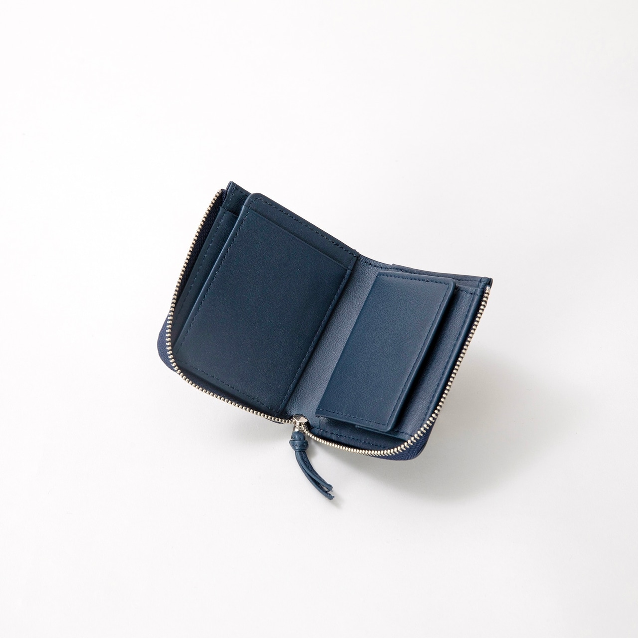 E R A. CALF CORNER PALM WALLET  S010