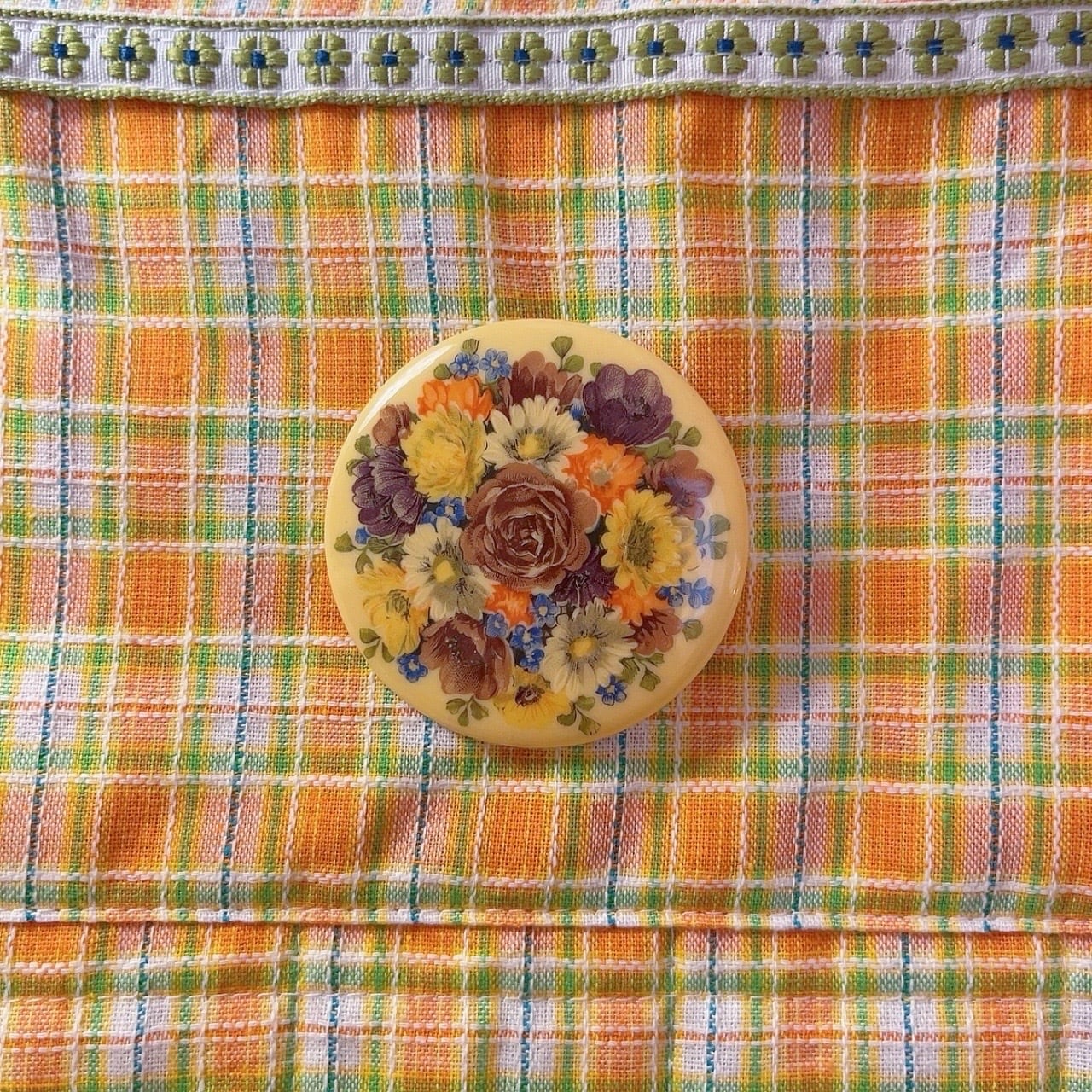 yellow floral round brooch