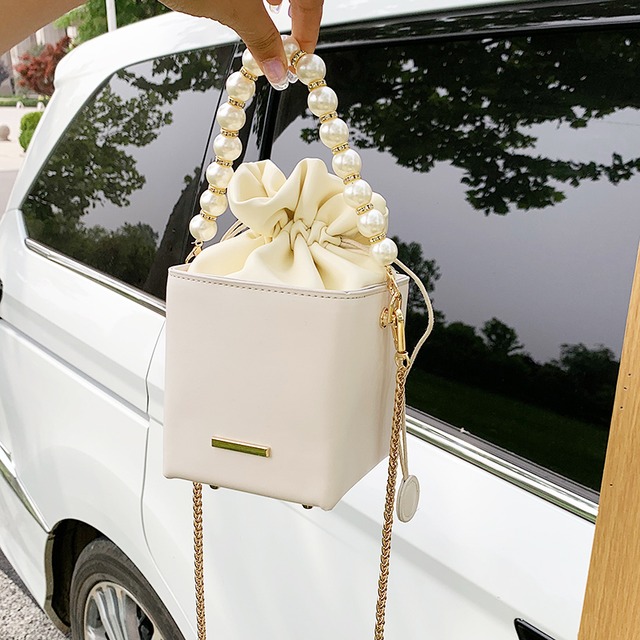 新しい質感の小さなバッグ女性バッグ2020新しいトレンディなワイルドパールチェーンクロスボディバッグワイルドバケットバッグ Tiancai_Wing_Bag3079269