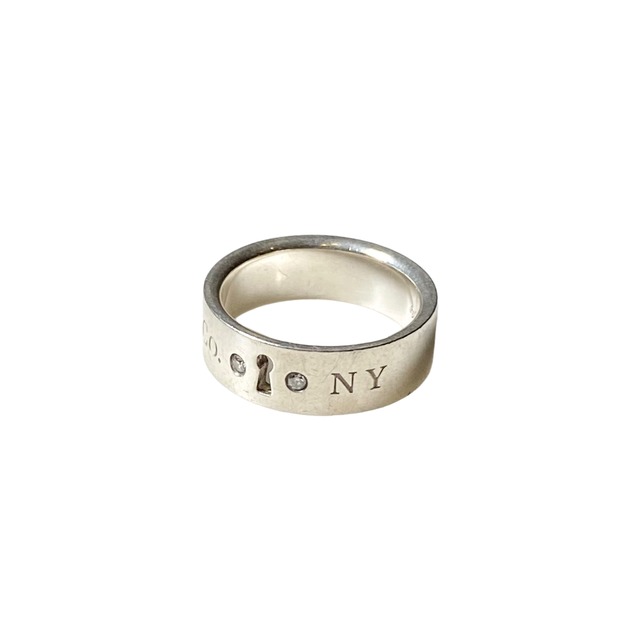 TIFFANY silver “Lock” ring set with 2p Diamonds