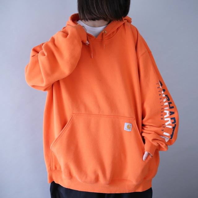 "Carhartt" sleeve logo printed XXXL over silhouette orange sweat parka