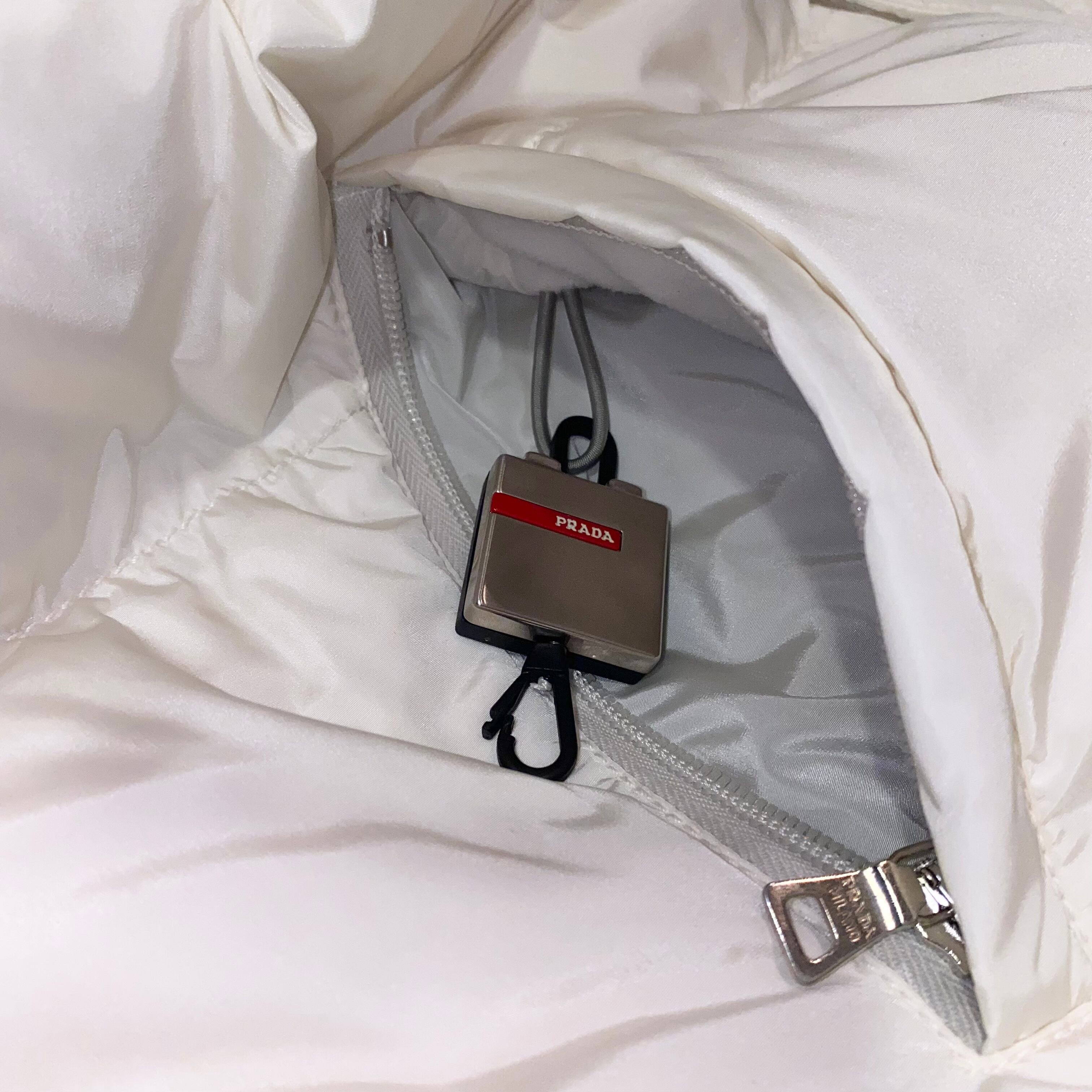 PRADA SPORT white down jacket & hat | NOIR ONLINE