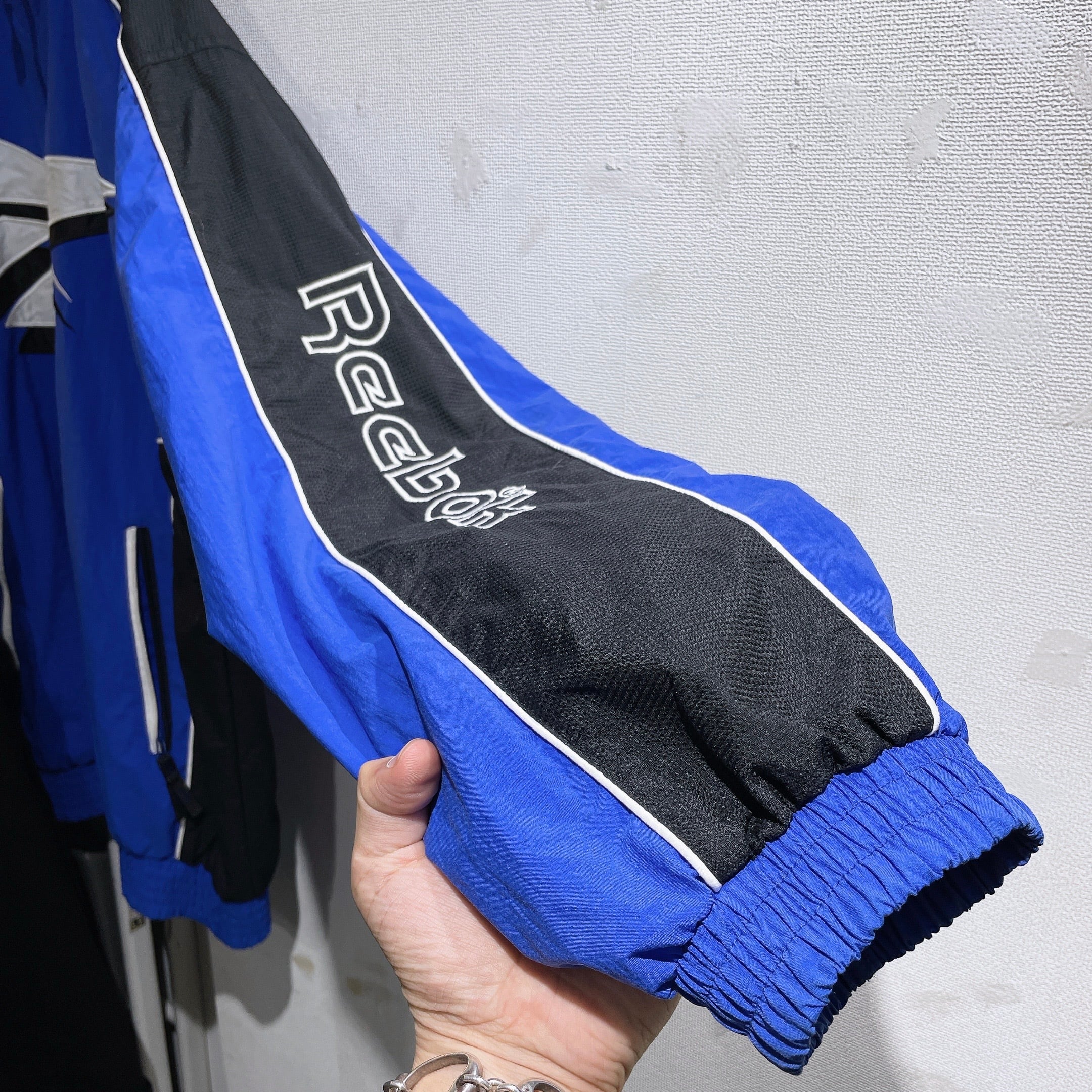 1990s ” Old Reebok ” Big vector logo Embbossed vintage Track jacket