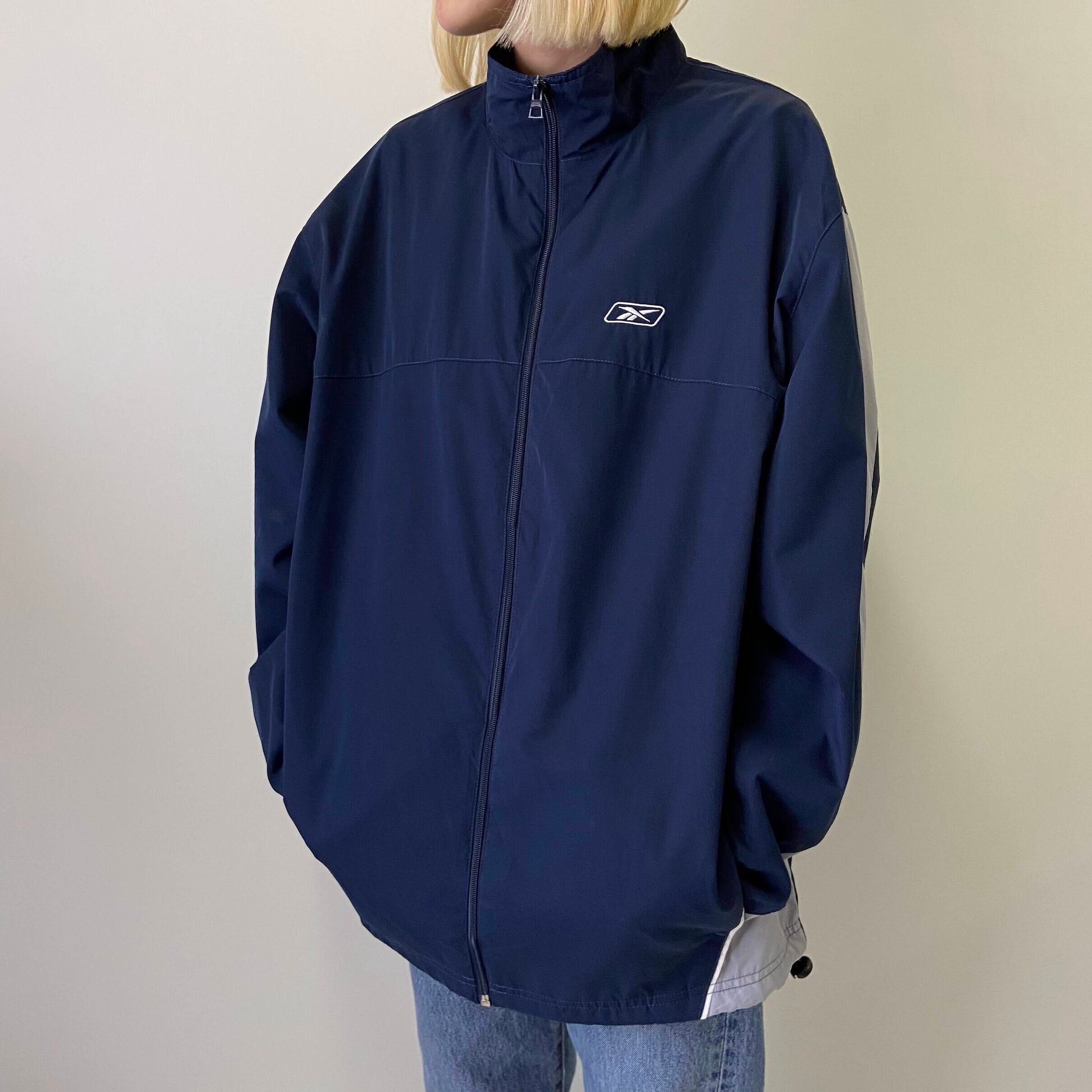 Reebok リーボック ワンポイントロゴ刺繍 ポリエステル ジャージジャケット メンズxl 古着 ネイビー 紺色 ジャージ トラックジャケット Cave 古着屋 公式 古着通販サイト