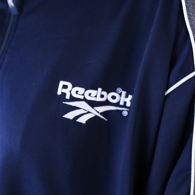 "Reebok" piping and logo taping tech design over silhouette track jacket