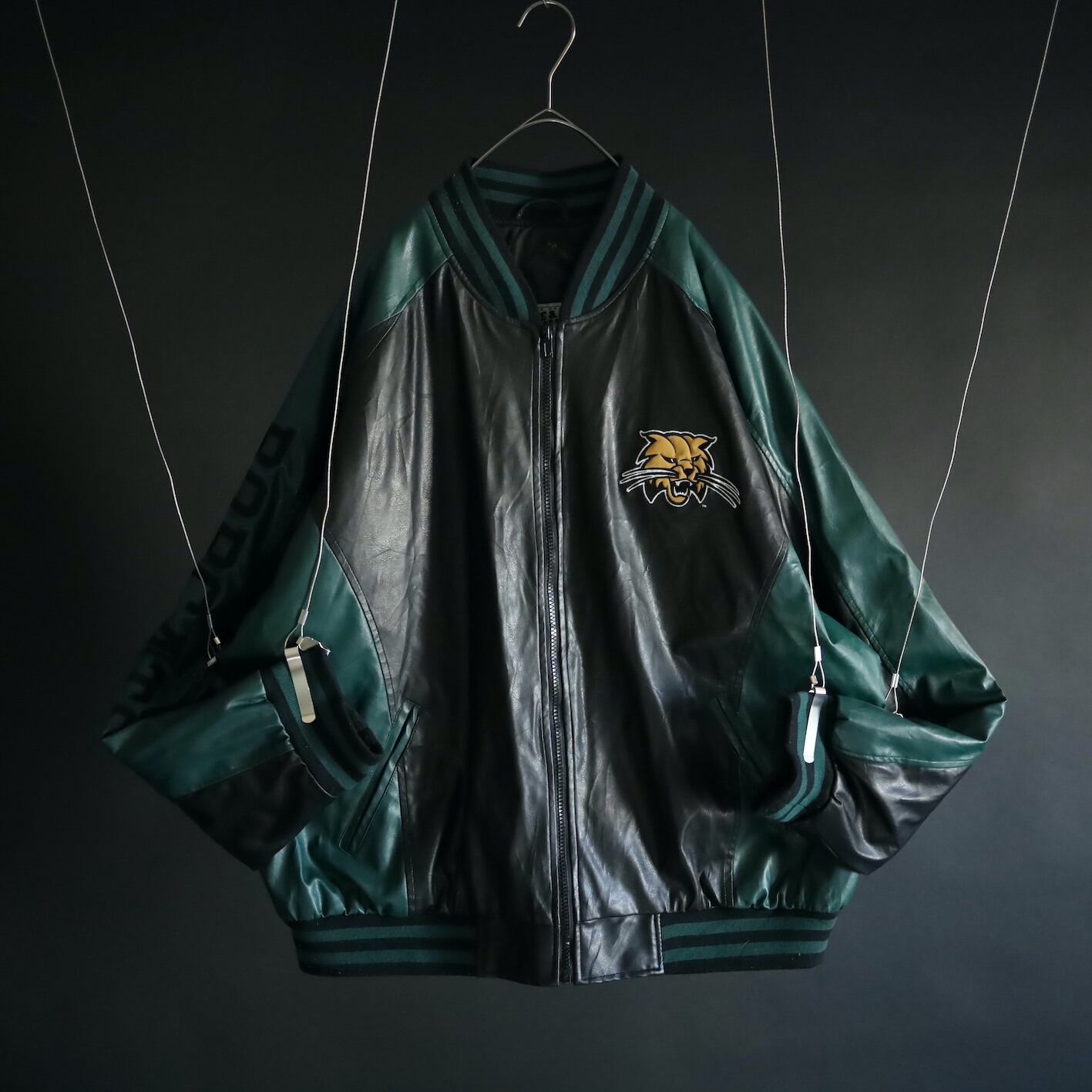 over silhouette black × green bi-color switching design fake leather jacket
