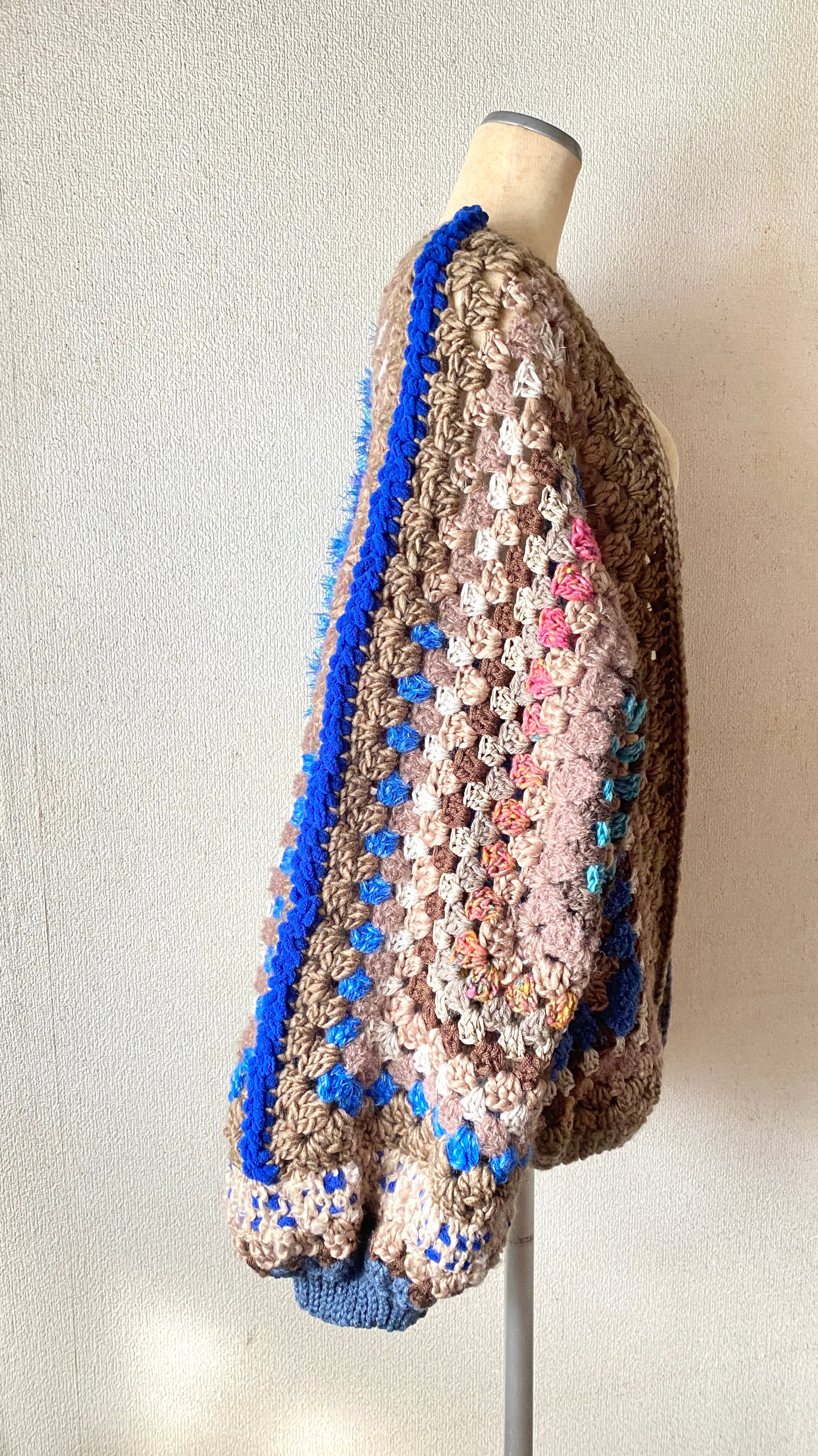 Crocheted granny hexagon and square motif asymmetrical cardigan