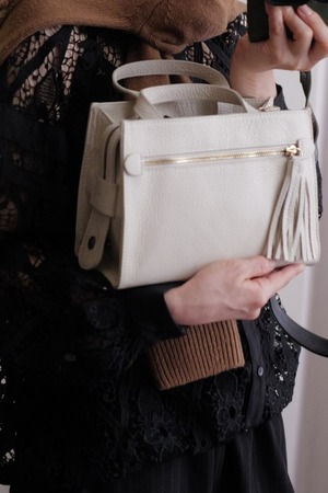 leather hand zip bag off white