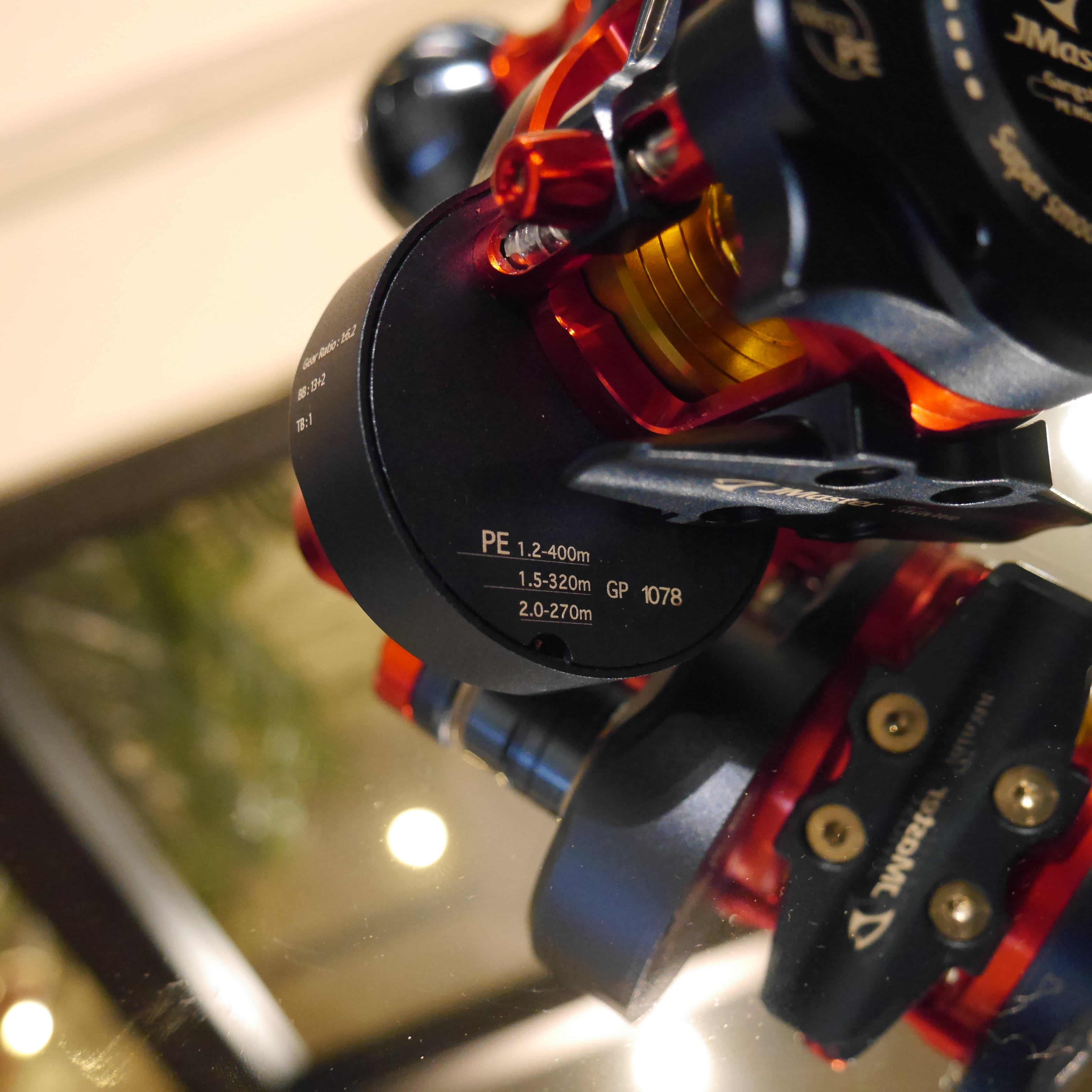 Dark/Red/Gold JM Gangster PE Micro Reel | RedfishBluefish手巻き