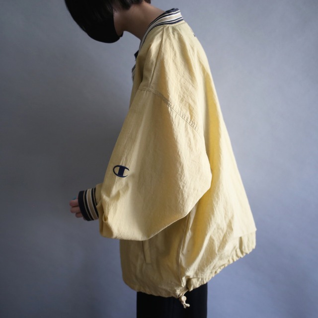 "Champion" knit rib design over silhouette yellow nylon pullover