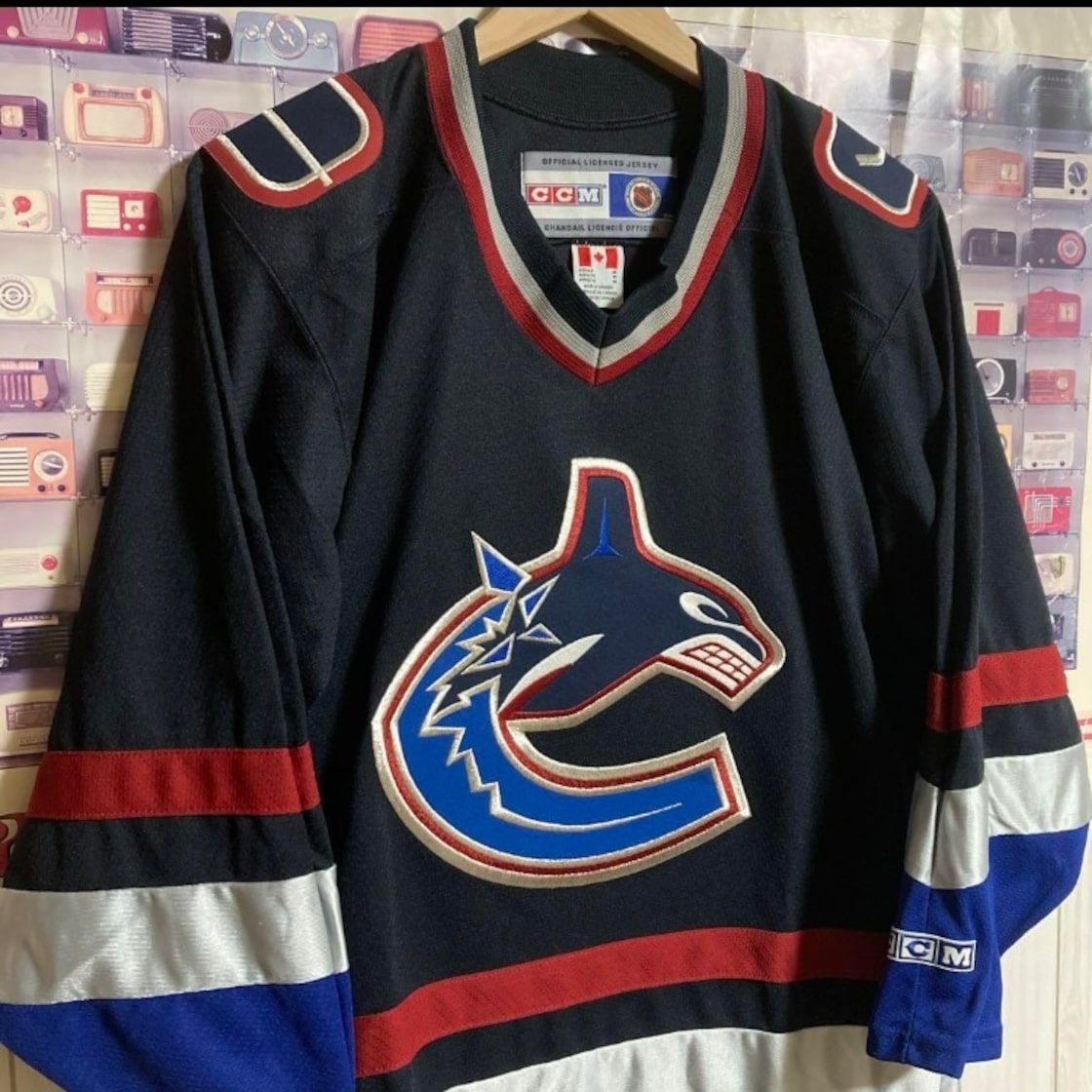 90sカナダ製CCM NHLバンクーバーカナックスアイスホッケーゲームシャツ 