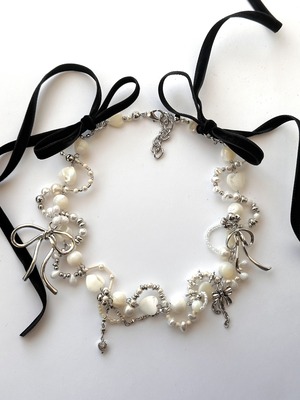 Mother of pearl back twin ribbon necklace.