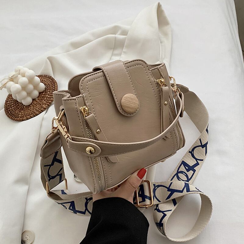 香港スタイルのレトロバケツバッグ女性2020人気の新しいトレンドバージョンの野生のファッションワイドショルダーストラップシングルショルダーメッセンジャーバッグ Tiancai_Wing_Bag1895572