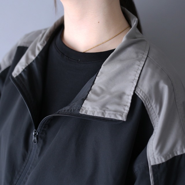 bi-color high-neck half-zip tech design over silhouette pullover