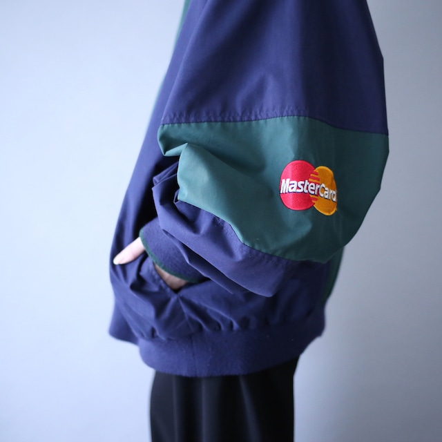 "Master Card" green × navy bi-color switching half-zip pullover