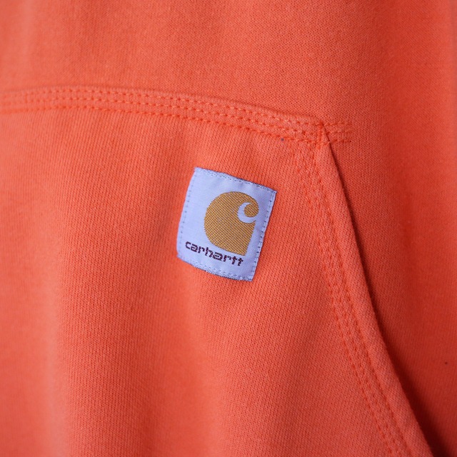 "Carhartt" sleeve logo printed over silhouette orange sweat parka