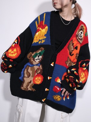 halloween motif graphic design XXX over silhouette cardigan