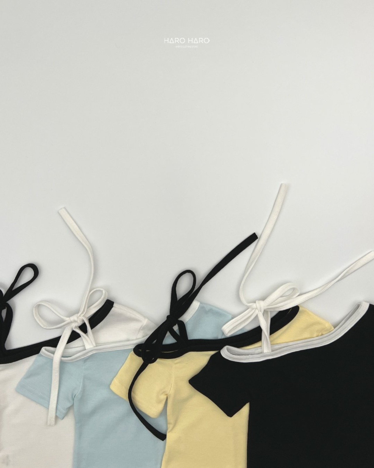[HARO HARO] Ribbon Asymmetrical Shoulder Top / [하로하로] 리본언발숄더티
