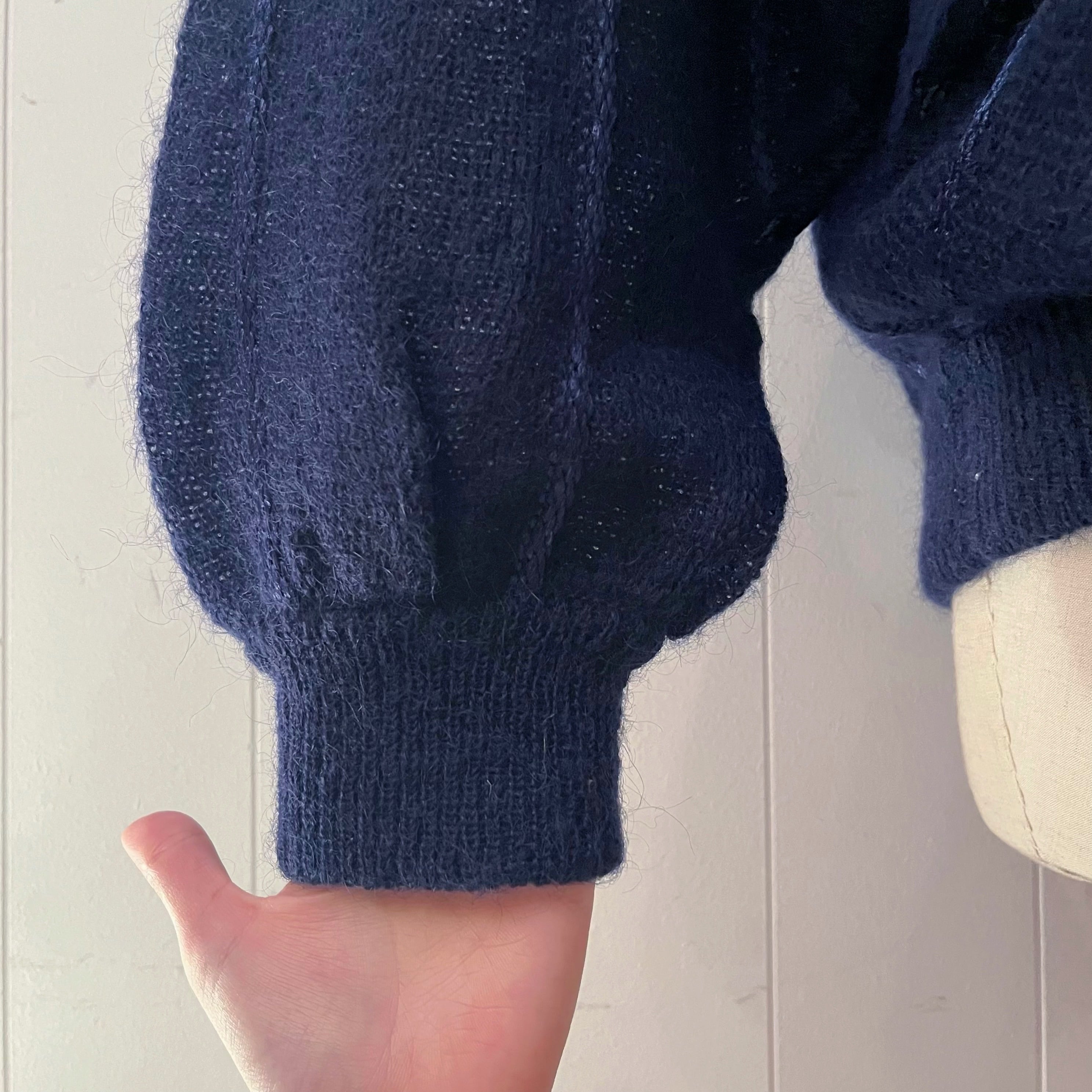 blue radial pattern knit sweater