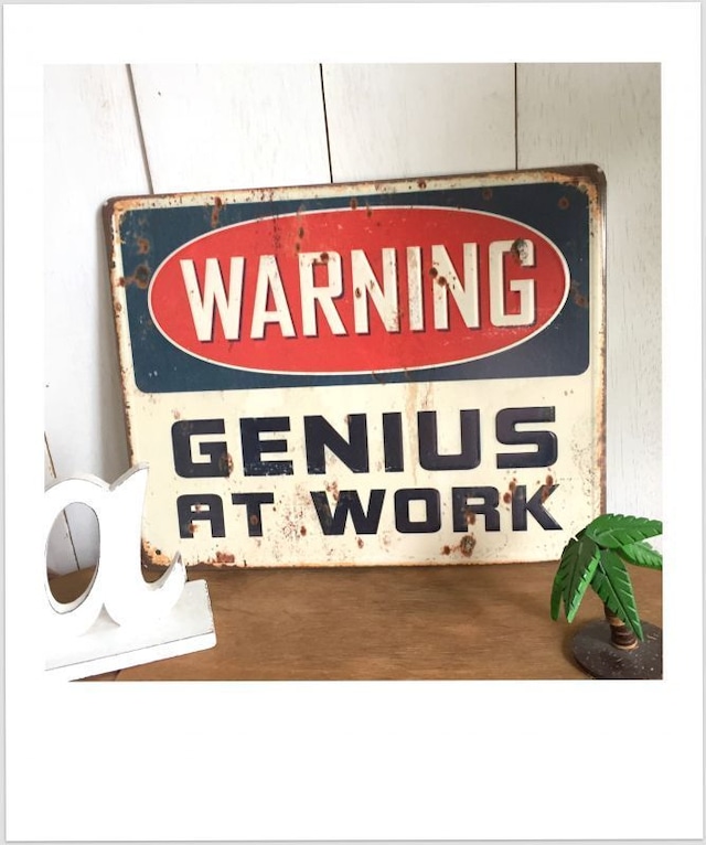 ティン サインボード WARNING　「GENIUS AT WORK」