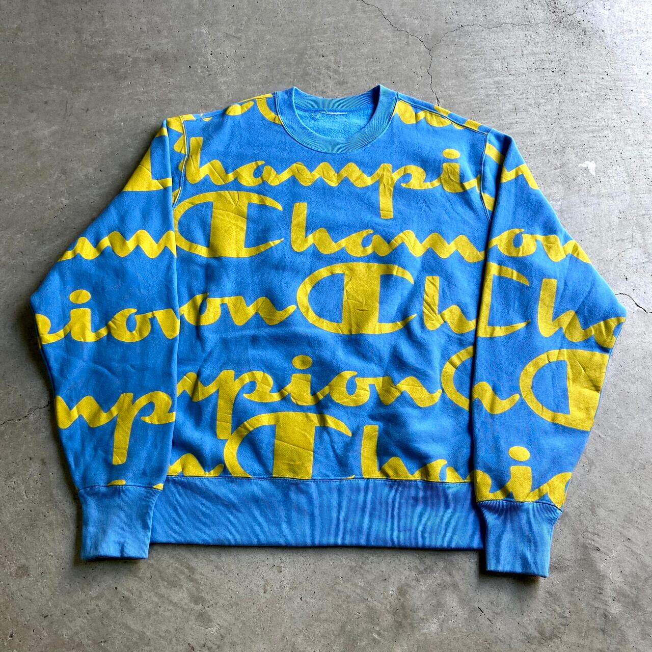 ビッグサイズ チャンピオン 総柄 ビッグロゴプリント リバースウィーブ メンズ2xl相当 古着 Champion Reverse Weave スウェット トレーナー スカイブルー イエロー 水色 黄色 大きいサイズ スウェット Al2110 Cave 古着屋 公式 古着通販サイト