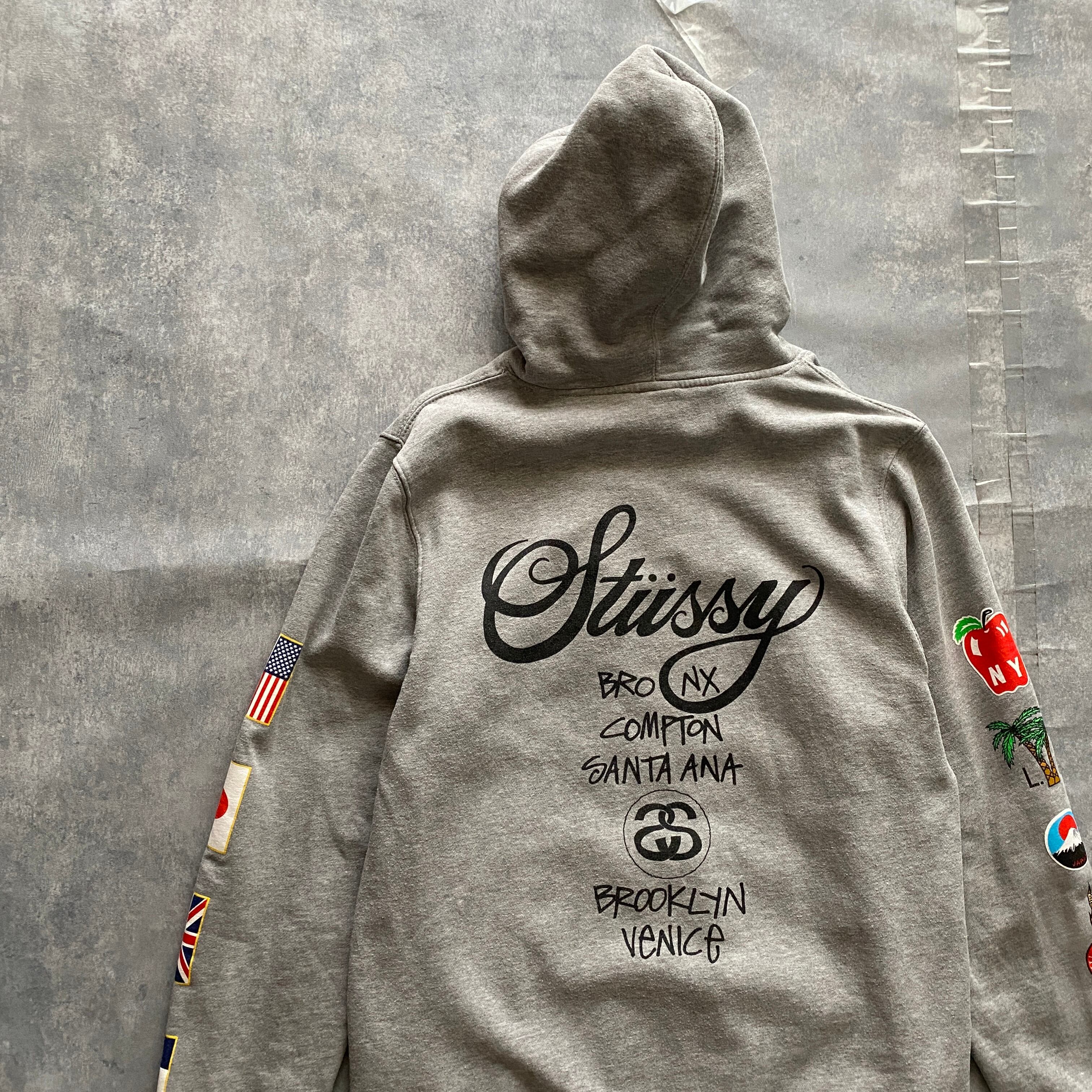 STUSSY ステューシー パーカー ロゴ バックプリント ワールドツアー