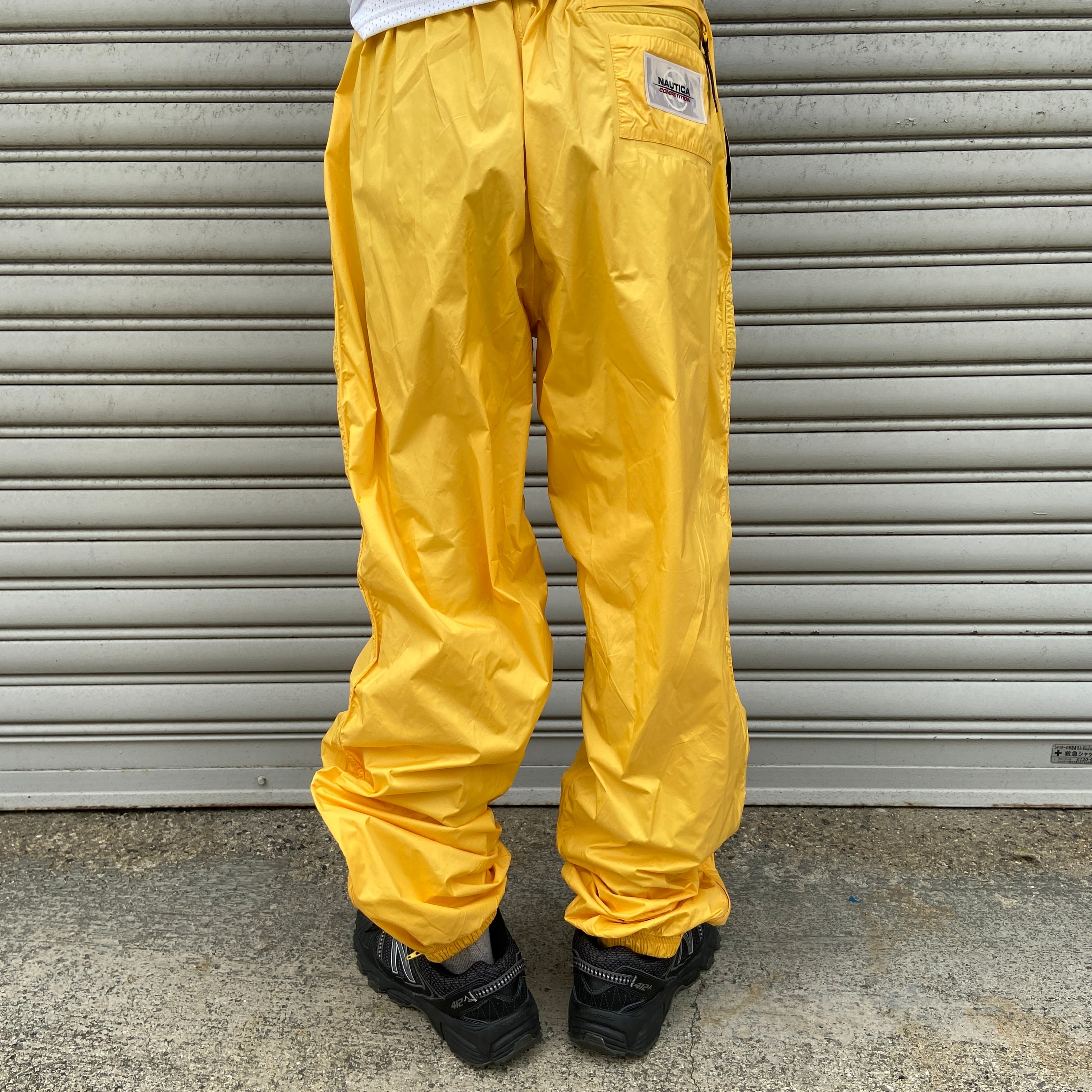 90s NAUTICAコンペティション ナイロンパンツ バターイエロー L | 古着