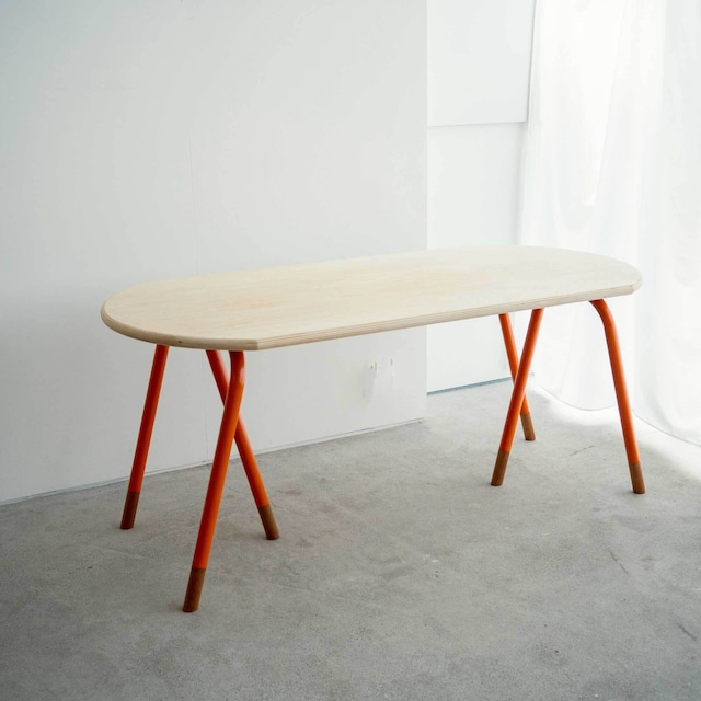 Table with plywood top and steel pipe legs