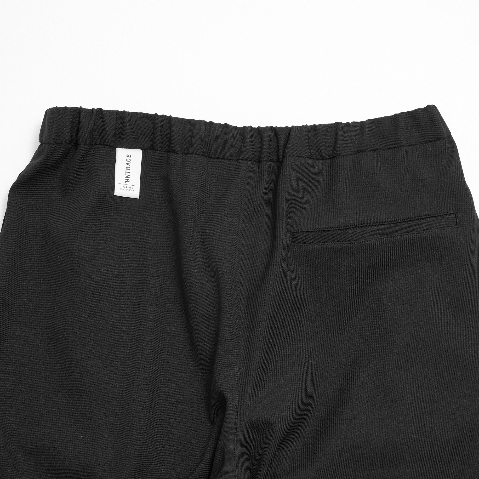 UNTRACE) UNTRACE BASIC TAPERED STRETCH TRACK PANTS STSLTX | apt335nyc