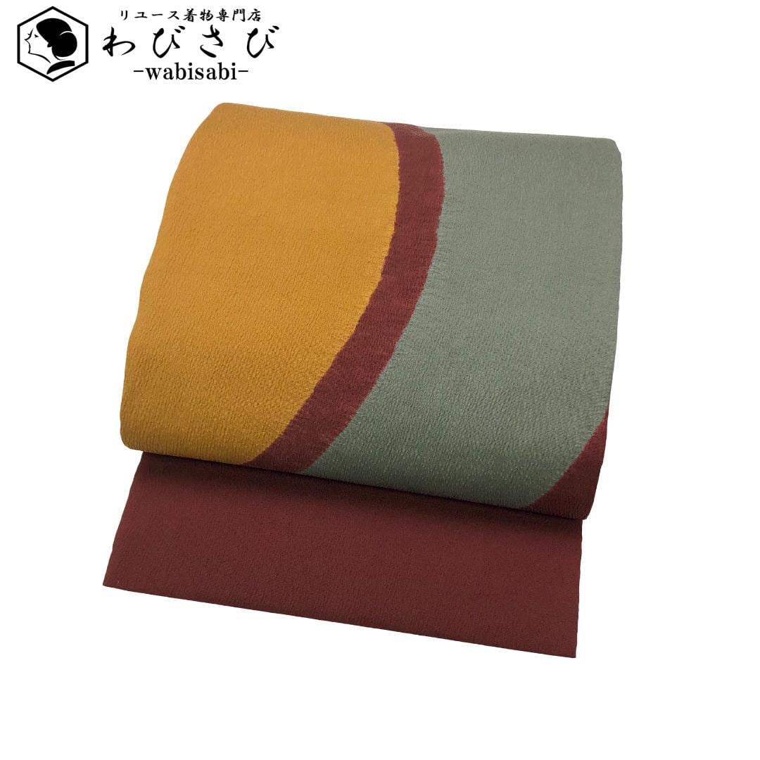 名古屋帯 美展作家 松本隆男 丸に鯉 花模様 縮緬 青褐色 O-5520 着物